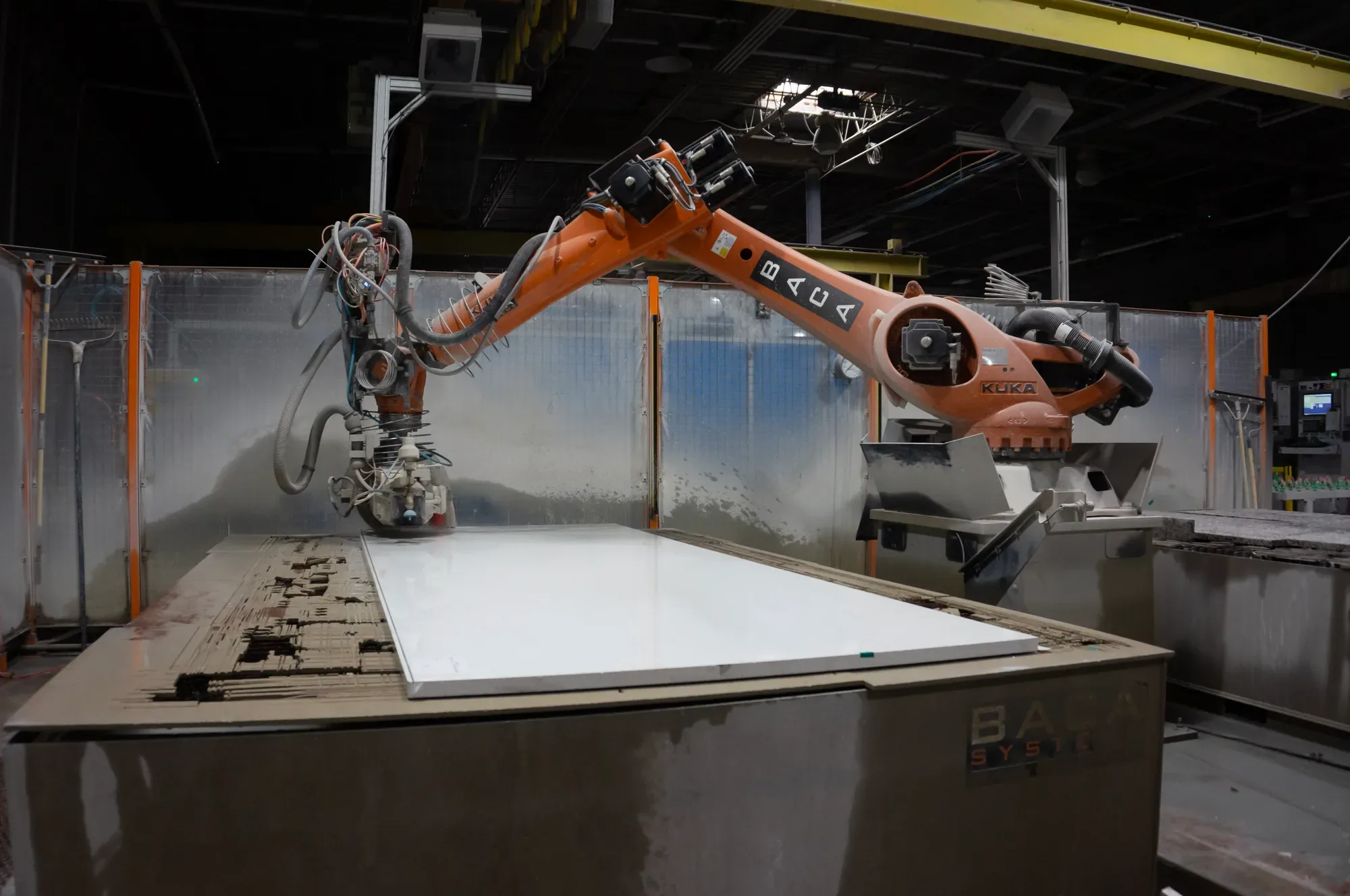 Artelye robotic fabrication equipment processing a stone slab in the Beltsville shop