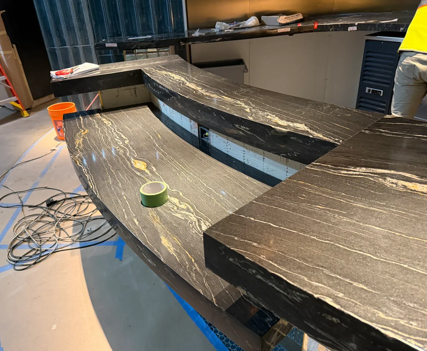 Pale natural veining and thick edge detail on the casino stone bar