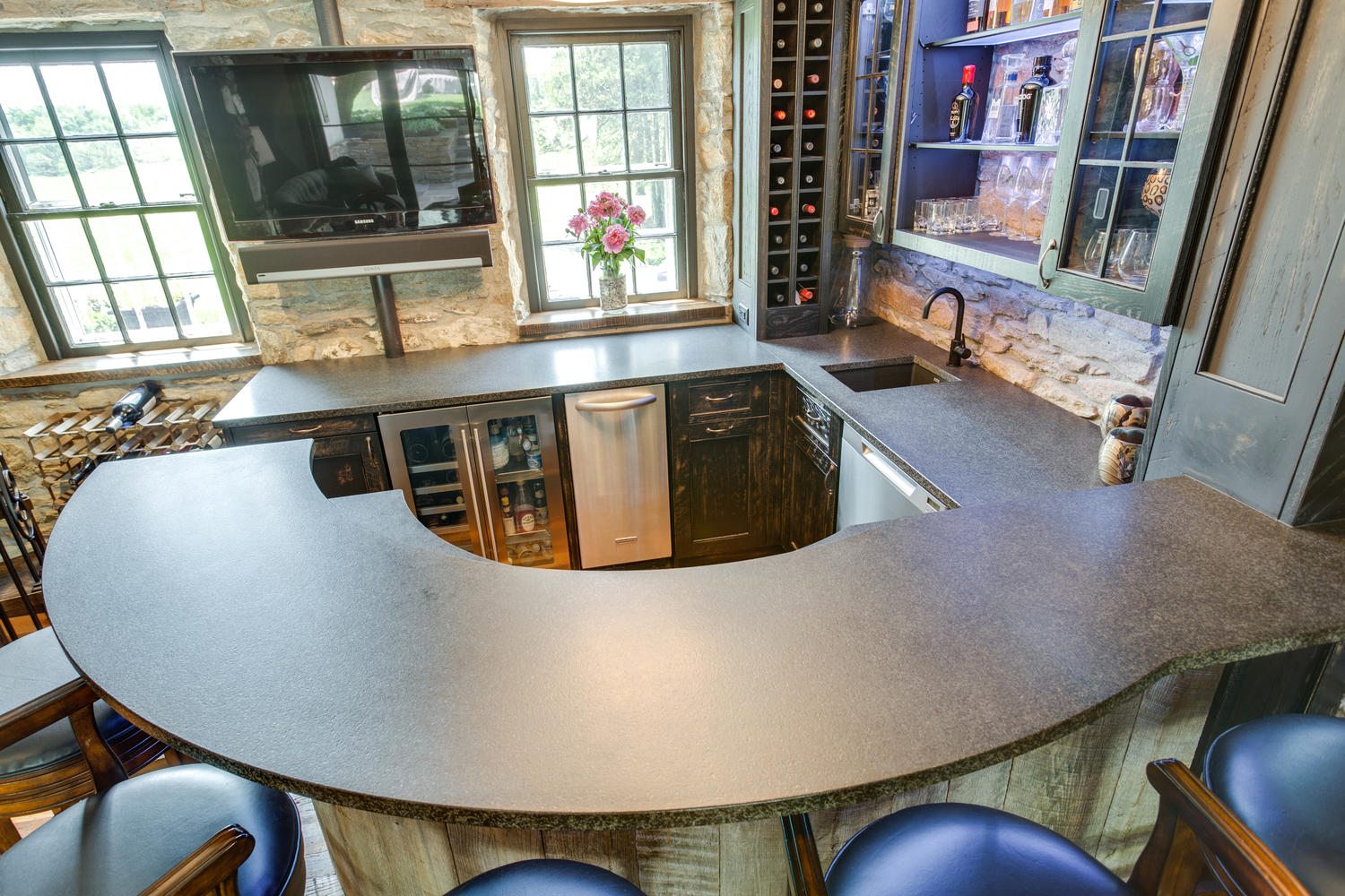 Kitchen bar with various drinks on the shelves
