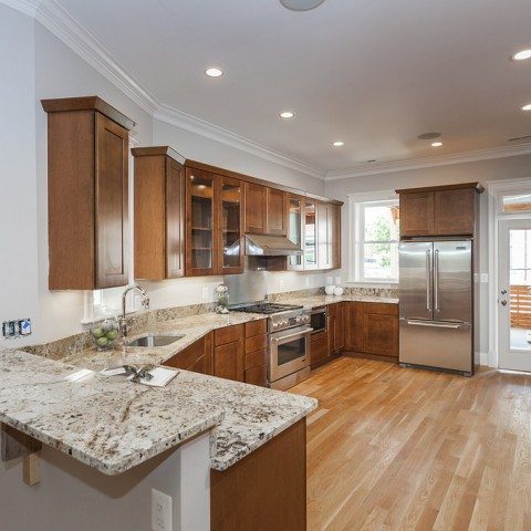 16157555143_e76580b0c3_b-480×480-2 A traditional kitchen with wood cabinets, light granite countertops, and wood floors