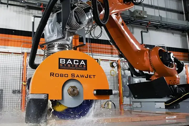 A BACA Systems Robo Sawjet is shown cutting stone with a large circular blade