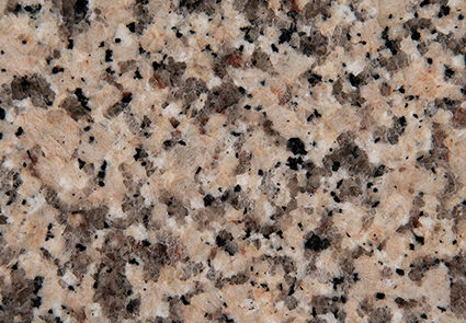 Crema Caramel granite slab featuring warm beige and brown tones with natural veining